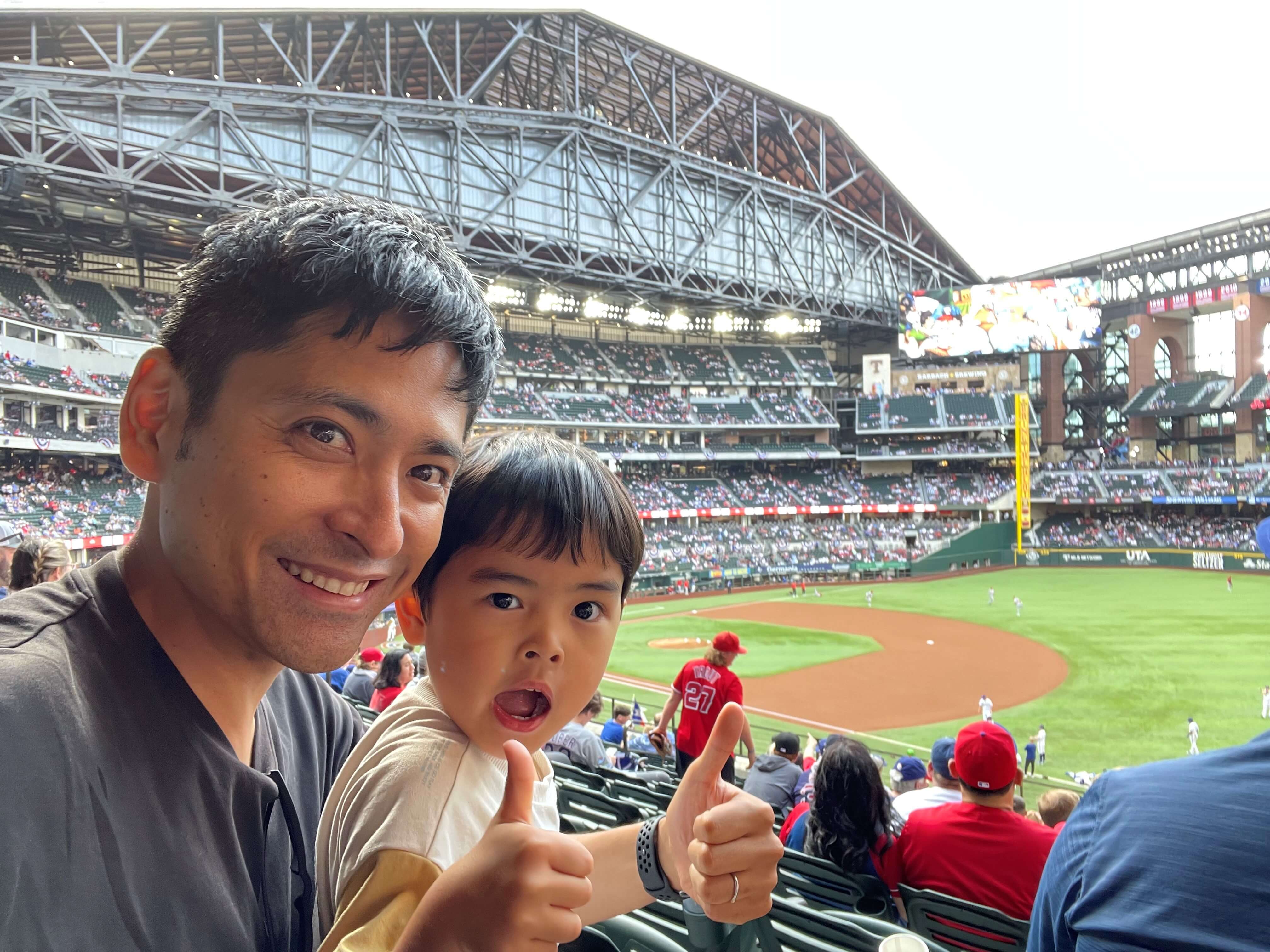 Ren with his son at a baseball game.
